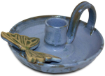 blue ceramic candle holder with butterfly decoration, the sandalwood room