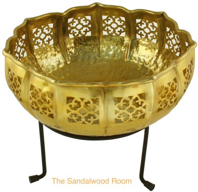 decorative filigree metal bowl mounted on a stand, the sandalwood room
