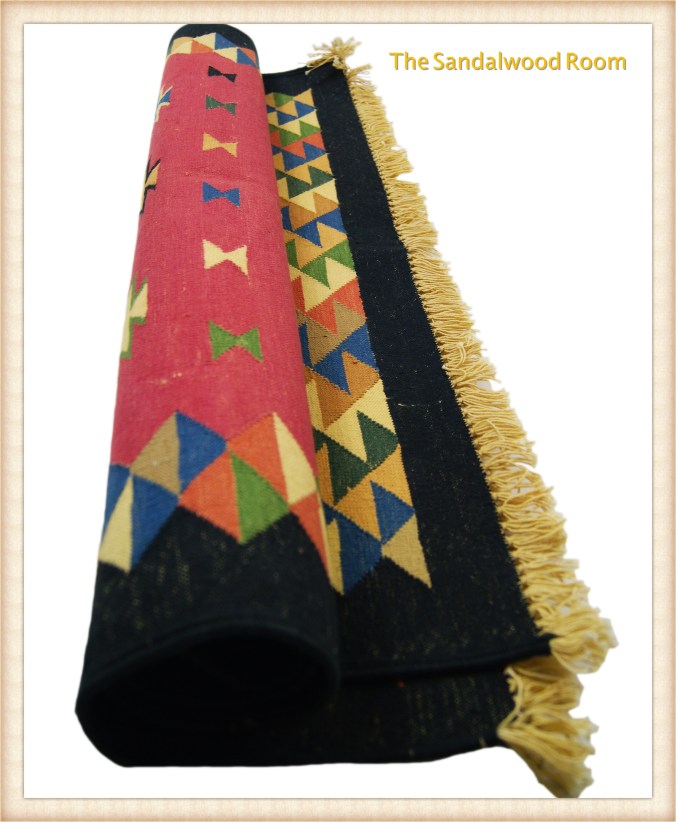 tsr-rug-rolled_fotor, the sandalwood room, hand knotted